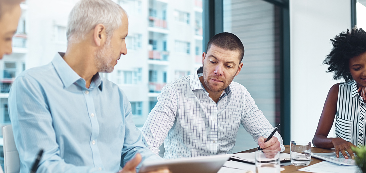 Two older men in a meeting