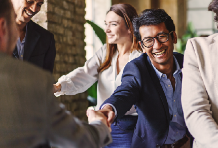 People shaking hands at an event